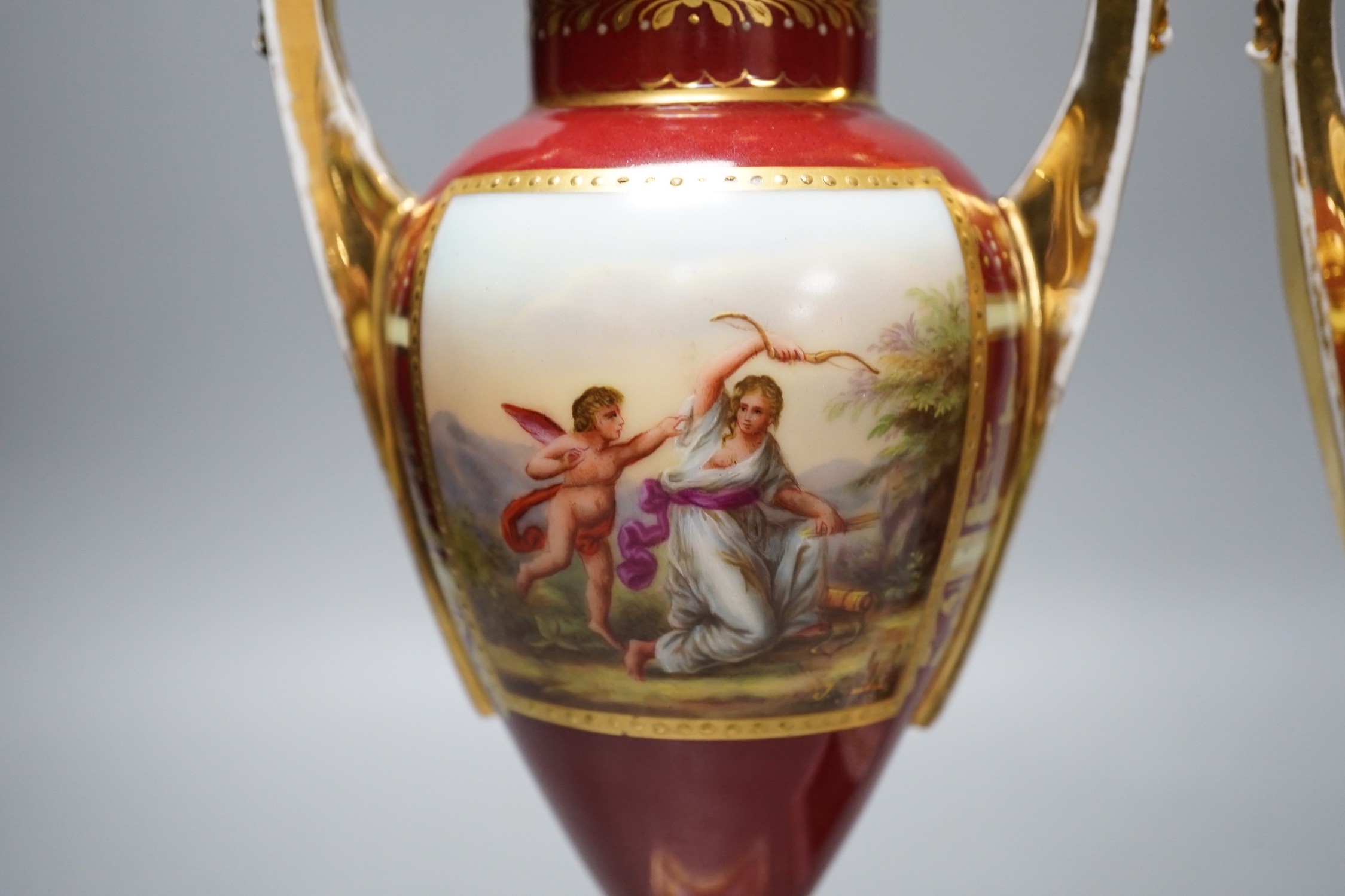 A pair of Vienna style painted porcelain vases, early 20th century 25cm